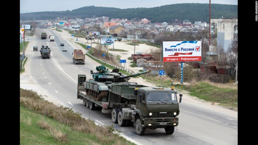 Ukrainian tanks are transported from their base in Perevalnoe, outside Simferopol, Crimea, Wednesday, March 26, 2014. Ukraine has started withdrawing its troops and weapons from Crimea, now controlled by Russia. (AP Photo/Pavel Golovkin)